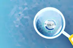 A magnifying glass hovering over a smartphone displaying a pix key icon